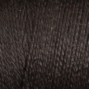 Close-up image of Maurice Brassard's 16/2 Bamboo Yarn in black. The texture is detailed, showcasing the individual strands tightly twisted together with slight variations in thickness, indicating a natural fiber composition. Made from sustainable Bamboo yarn, its matte appearance with subtle lighter flecks adds to its charm.