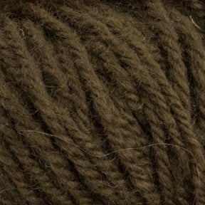 A close-up view of dark olive green Halcyon Deco Rug Wool reveals thick, twisted strands with a touch of minor fuzziness, highlighting their texture and softness. Perfect for creating a rug masterpiece, this versatile yarn from Caledonian Dye Works is an excellent choice for any project.