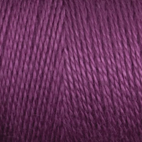 Close-up of a skein of Maurice Brassard's 8/2 Bamboo Yarn | Mini-cone. The fibers are tightly wound and have a smooth texture, showcasing various shades of purple from light to dark. This environmentally friendly yarn appears soft and perfect for knitters' crochet or knitting projects.