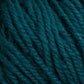 Close-up photo of Halcyon Deco Rug Wool by Caledonian Dye Works, revealing the texture and detail of individual dark teal strands twisted together. Lint and fibers highlight the cozy warmth of this versatile yarn, perfect for any project.