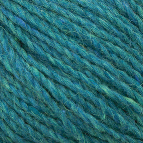 Close-up image of the Peace Fleece Yarn by Harrisville Designs. The soft, teal yarn features a slightly fuzzy texture and a loose twist, highlighting fine fibers and subtle color variations from darker to lighter teal shades. This wool and mohair blend is ideal for worsted weight knitting projects.