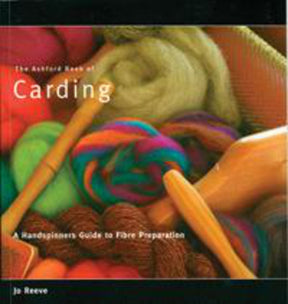 Cover of "The Ashford Book of Carding" by Jo Reeve, published by Ashford Handicrafts Limited. The cover features vibrant, fluffy fiber materials and wooden carding tools, highlighting the book’s emphasis on fiber preparation and carding tutorials for handspinners. The title and subtitle are presented in white text.