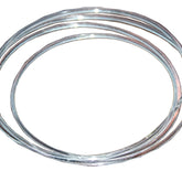 Close-up of a coiled silver wire with a shiny, reflective surface. The wire, much like the precision-crafted Kromski Poly Drive Band, is neatly wound in concentric circles and appears smooth and metallic, embodying the quality associated with Kromski North America.