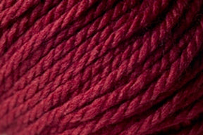 Close-up image of Jo Sharp Silkroad Ultra by Kingfisher Yarn & Fibre, tightly wound in a thick bundle. The super soft texture of this burgundy-colored yarn is smooth, with clearly visible fibers that showcase a rich and vibrant hue, making it perfect for cozy winter accessories.