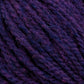 Close-up of Harrisville Shetland Yarn - Unwashed Cones by Harrisville Designs in deep purple. The image shows the soft texture and twisted strands, highlighting subtle variations in the purple hues—perfect for intricate Fair Isle knitting designs.