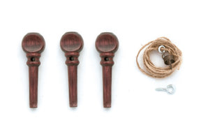 The Kromski Brake Band Set for Polonaise, featuring three wooden tuning pegs, a small coil of hemp string, a small round object with a hole, and a metal eye screw from Kromski North America, is arranged on a white background.