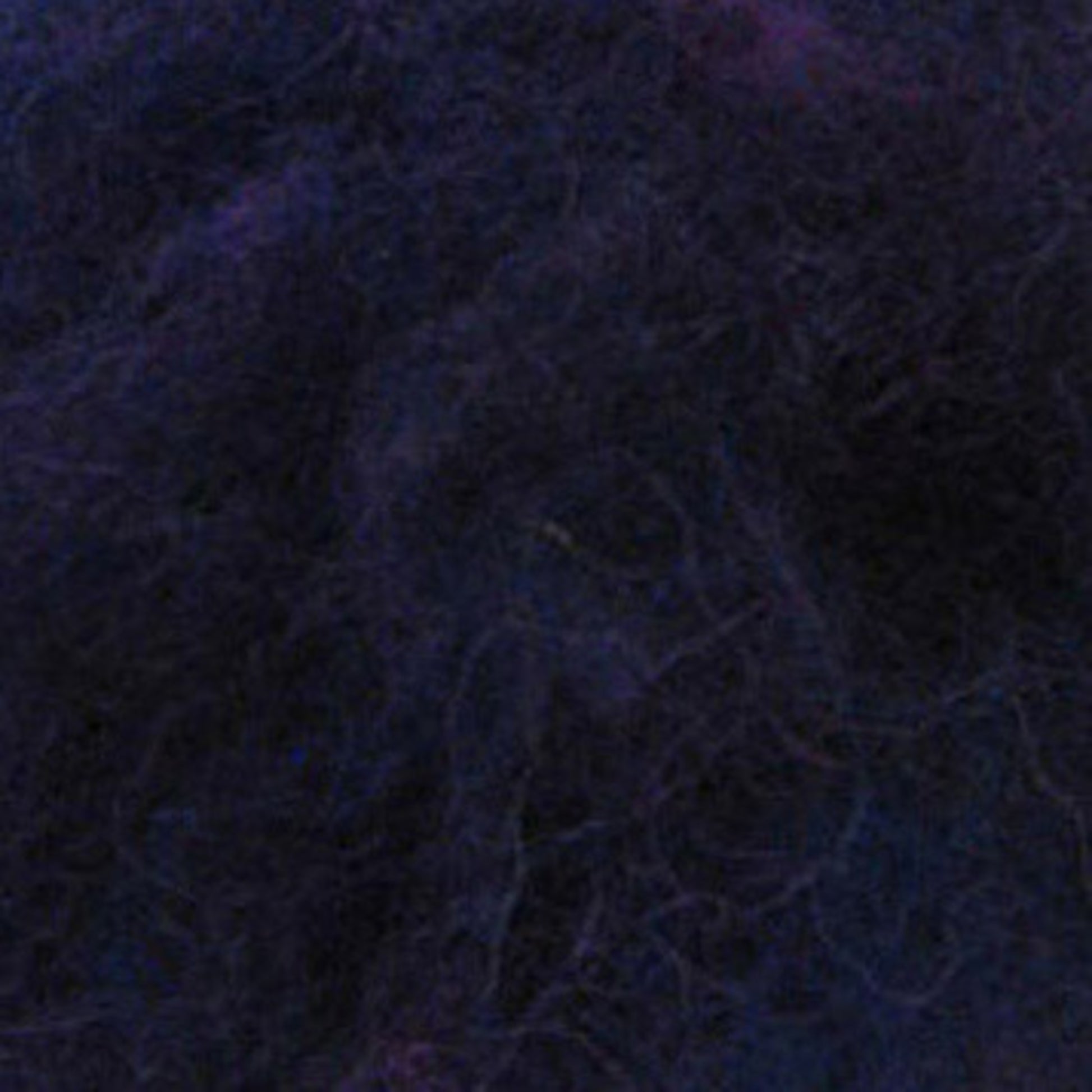 A close-up view of Harrisville Dyed & Carded Wool Fiber by Harrisville Designs reveals a dark, fuzzy texture with shades of blue and purple, resembling soft, densely packed fibers or felt. The intricate web of fibers creates a complex and rich pattern reminiscent of heathered colors.