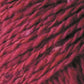 Close-up image of thick, twisted red fibers in a Jo Sharp Silkroad DK Tweed blend by Kingfisher Yarn & Fibre. The texture showcases various shades of red, giving it a rich and varied appearance. The fibers appear soft and dense, capturing the luxury of wool, silk, and cashmere.