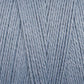 Close-up image of Maurice Brassard's 8/2 Bamboo Yarn strands in light blue, forming a textured crisscross pattern. The environmentally friendly fibers are tightly wound together, creating a soft and smooth appearance.