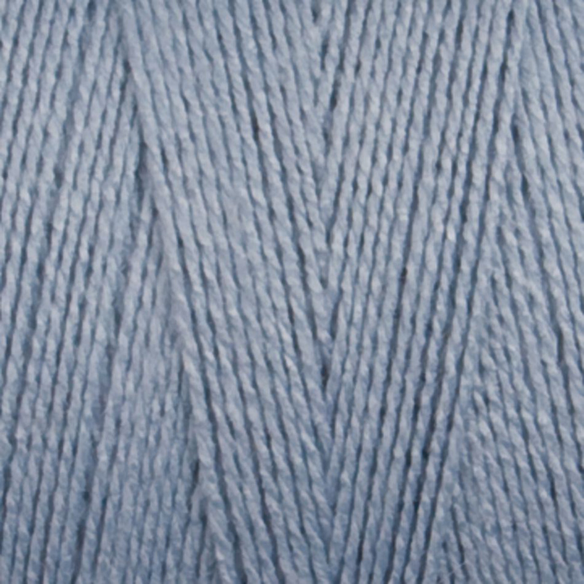 Close-up image of Maurice Brassard's 8/2 Bamboo Yarn strands in light blue, forming a textured crisscross pattern. The environmentally friendly fibers are tightly wound together, creating a soft and smooth appearance.