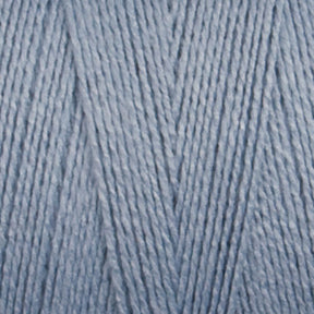 Close-up image of Maurice Brassard's 8/2 Bamboo Yarn strands in light blue, forming a textured crisscross pattern. The environmentally friendly fibers are tightly wound together, creating a soft and smooth appearance.