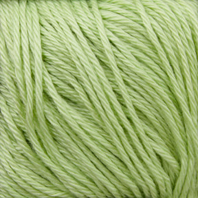 Close-up of a bundle of Cascade Ultra Pima Cotton Yarn in light green, neatly wound together, showcasing its smooth texture and consistent twist. Made from Peruvian Pima Cotton by Cascade Yarns, the yarn appears soft with a delightful hand, making it ideal for knitting or crocheting projects. The light green color gives it a fresh and vibrant appearance.