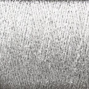 Close-up of a spool of Astra Glow Metallic yarn by Huntingdon Yarn Mill, Inc. The texture is slightly fuzzy, with threads intertwining to create a shimmering, reflective surface. The overall look is textured, with a mix of fine and slightly thicker strands woven together. For best results, hand wash items made from this beautiful yarn on its large cone.