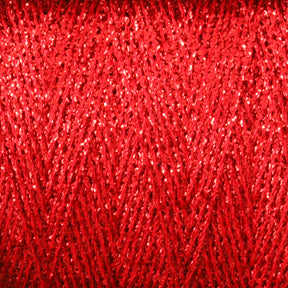 Close-up of Astra Glow Metallic yarn in red, wound tightly around a large cone. The shiny, reflective fibers create a zigzag pattern, showcasing intricate detail and texture. A great weaving tip from Huntingdon Yarn Mill, Inc. is to occasionally hand wash to maintain its vibrant color and sparkling surface, making it visually striking and eye-catching.