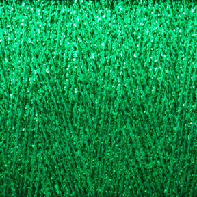 A close-up image showcases a densely layered, vibrant green texture with a somewhat glossy surface. The pattern consists of tightly interwoven threads, resembling artificial grass or a textured fabric, ideal for hand and machine knitters using Huntingdon Yarn Mill's Astra Glow Metallic | Mini-cone to create visually rich and intricate designs.