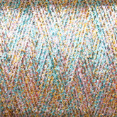 A close-up view of the Astra Glow Metallic yarn spool from Huntingdon Yarn Mill, Inc. reveals interwoven threads in pastel shades of blue, pink, white, and gold. The metallic yarn adds a shimmering effect, creating a vibrant and textured appearance. To maintain the beauty of your creations made with this large cone of yarn, it is recommended to hand wash them gently.