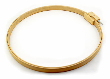 The FA Edmunds & Co., Inc. Wooden Rug Hooking Hoop, measuring 18" in diameter and 1 1/8" in height, is ideal for fabric hoop or chair pad projects. It features a small metal screw fastener at the top for tightening the inner ring and is showcased against a white background.