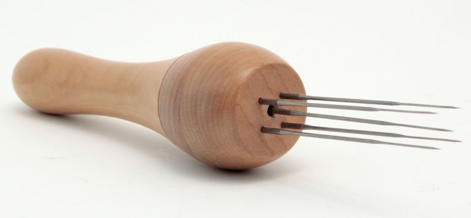 The Ashford Needle Felting Punch, a product from Ashford Handicrafts Limited, features a smooth, rounded wooden handle designed for easy gripping and holds four sharp metal needles extending from one end, making it ideal for felting or similar crafting activities. The tool is displayed against a plain white background.