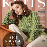 Magazine cover featuring a woman with auburn hair, wearing a green, patterned sweater. The title reads "Interweave Knits Spring 2022" from Golden Peak Media with the text "The Art Nouveau Issue." Additional text highlights topics in the issue such as knitting designs, fine art, and insights from renowned colorwork designers.