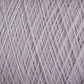 Close-up of tightly wound, light gray JaggerSpun Maine Line 3/8 Yarn | Large Cone from Jagger Brothers, Inc., showing detailed, crisscrossing threads. The texture of the soft medium grade wool fibers is visible, creating a pattern of intersecting lines and an intricate, overlapping design.