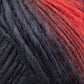 Close-up of a skein of Louisa Harding Amitola Grande yarn by Knitting Fever / Euro Yarns, showcasing a gradient transition from deep black to warm red. The thick, slightly fuzzy fibers create a rich, textured appearance.