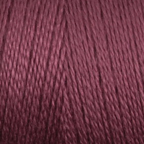 A close-up image of Maurice Brassard's 8/2 Bamboo Yarn in burgundy. The texture appears smooth, with uniformly twisted strands that create a consistent and rich hue. The photo emphasizes the yarn's details, showcasing its silky and slightly shiny appearance—ideal for environmentally conscious knitters.