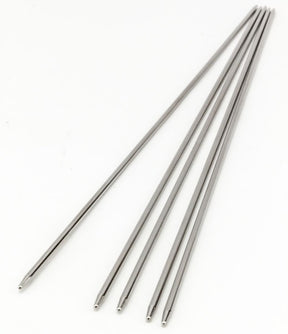 A set of five Addi Steel Double Point Knitting Needles, 8", by Skacel is laid out on a white background. They are identical in appearance and arranged with a slight fanning effect. These thin, polished metal needles are uniform in diameter, perfect for fine lace sizes.