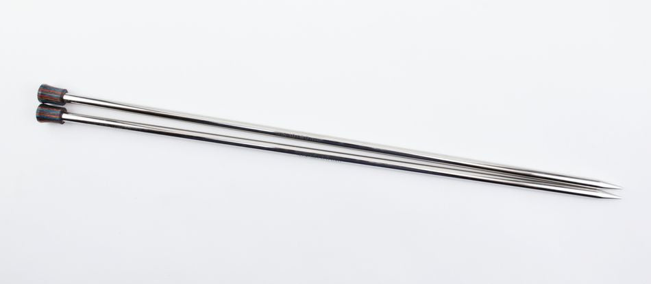 Two gleaming Nova Platina Single Point Knitting Needles from Accessories Unlimited are positioned parallel to each other on a plain white background. These needles, crafted from hollow brass pipes, feature pointed tips and black knob-like ends with red accents.