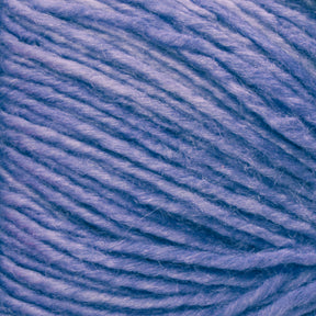 Close-up of Malabrigo Silky Merino from Malabrigo Yarn, featuring soft, textured blue yarn with visible strands and fibers that showcase a gentle, slightly fluffy appearance.