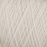 A close-up view of a bundle of cream-colored JaggerSpun Maine Line 3/8 Yarns from Jagger Brothers, Inc., showcasing the detailed texture and intricately neat fibers wound together. The strands form a soft and uniform pattern of worsted spun yarns on the large cone.