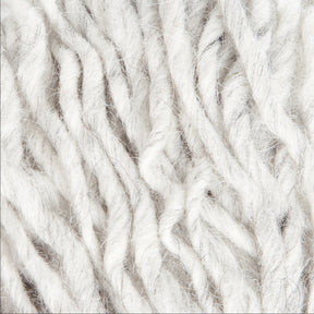 A close-up of Jöklalopi (Bulky Lopi) wool yarn fibers by Berroco, Inc., highlighting a soft and fluffy texture with natural off-white colors. The yarn strands are loosely wound, revealing their individual threads and slight variations in thickness, ideal for creating chunky winter sweaters that exude a rustic handmade charm.