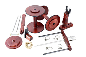 The Kromski Minstrel Wheel Great Flyer Set, by Kromski North America, features an array of wooden and metal components for a spinning wheel. The set includes spindles, rods, hooks, and various other parts, all beautifully arranged on a white background.