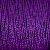 Close-up image of Supreme Corp.'s 10/2 Pearl Cotton Yarn | Mini-cone strands tightly wound together, filling the entire frame. The texture shows fine details of the fibers, with slight variations in the shades of purple, creating a rich, textured appearance.