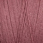 A close-up view of Maurice Brassard's 16/2 Bamboo Yarn strands arranged neatly in parallel. The texture of the yarn is visible, showcasing the intertwined threads and a soft, smooth surface. This antibacterial, sustainable yarn is colored in a muted, dusty rose pink.