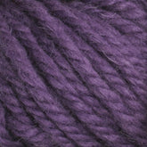 Close-up of thick, twisted strands of Halcyon Yarn Classic Rug Wool by Caledonian Dye Works in a rich purple hue, showcasing its fibrous texture and vibrant color. Reminiscent of traditional rug wool, the yarn appears soft and slightly fuzzy, indicating its suitability for knitting or crocheting cozy garments and accessories.