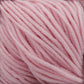 Close-up image of Plymouth Yarn Co.'s Plymouth Select Worsted Merino Superwash in soft pastel pink. The thick, closely wound strands highlight a smooth and fluffy texture with excellent stitch definition. The delicate and gentle appearance of the yarn makes it perfect for knitting or crocheting cozy garments.