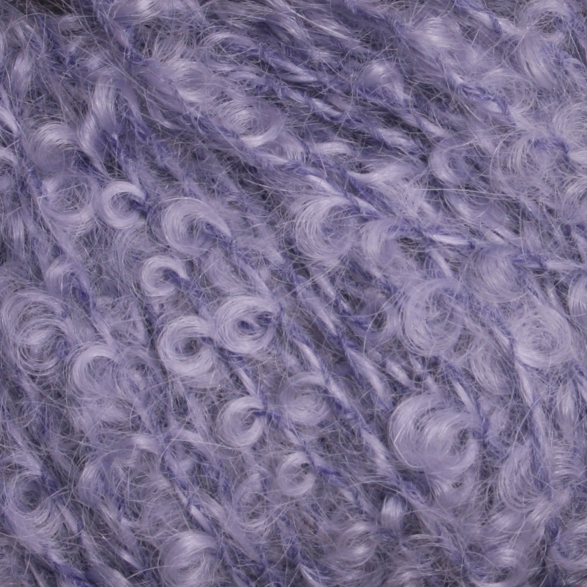 Close-up image of luxuriously soft, variegated light purple yarn from Caledonian Dye Works' Victorian Bouclé Mohair Yarn collection, featuring a mix of smooth and curly strands providing a rich texture. The Mohair Bouclé fibers have a shiny, slightly fluffy appearance, ideal for cozy knitting or crocheting projects.