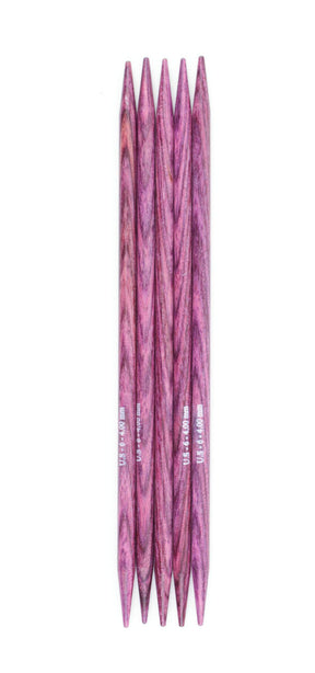 The set of five Dreamz Double Point Knitting Needles by Knitter's Pride from Accessories Unlimited, all measuring 5 inches in length and crafted from laminated birch, are neatly arranged side by side against a white background. Each needle has pointed ends on both sides and features a smooth, polished texture in a rich purple hue.