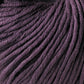 A close-up view of a ball of Jo Sharp Soho Summer DK Cotton from Kingfisher Yarn & Fibre, showcasing the tightly wound strands and soft texture. The summer yarn is neatly coiled, with visible individual fibers, providing a detailed look at its thickness and smoothness perfect for lightweight cotton projects.