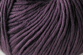 A close-up view of a ball of Jo Sharp Soho Summer DK Cotton from Kingfisher Yarn & Fibre, showcasing the tightly wound strands and soft texture. The summer yarn is neatly coiled, with visible individual fibers, providing a detailed look at its thickness and smoothness perfect for lightweight cotton projects.