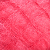 Close-up view of bright pink, fluffy, and textured Victorian Brushed Mohair Yarn from Caledonian Dye Works. The fibers appear soft and wispy, with various strands intertwining to form a cozy and vibrant material in large skeins.