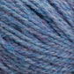 Close-up of a ball of Harrisville Designs' Harrisville Highland - Cones yarn in mixed shades of blue, with hints of purple. The image showcases the detailed texture of the unscoured fibers, highlighting the soft and thick appearance enhanced by spinning oils.