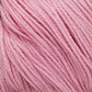 Close-up image of soft, pink yarn. The fibers are tightly wound and neatly arranged, showcasing the texture and consistency of the material. Made from Cascade Ultra Pima Cotton Yarn by Cascade Yarns, the light pastel pink color creates a delicate and soothing appearance with an incredibly soft hand.