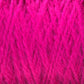 Close-up of bright pink Harrisville Shetland Yarn - Unwashed Cones by Harrisville Designs, showcasing its soft, fuzzy texture. The fibers are interwoven tightly, producing a vibrant and rich appearance. Reminiscent of Fair Isle knitting, this fluffy, wool-like material is an ideal choice for lightweight blankets, with details of individual strands clearly visible.