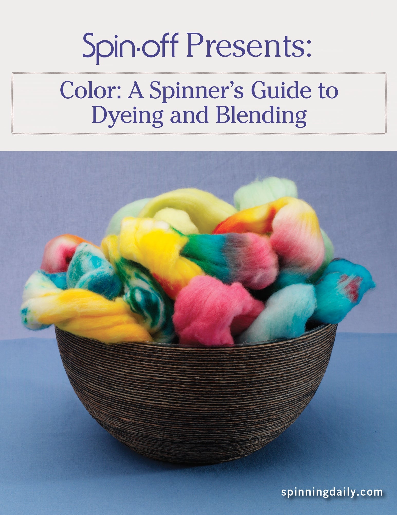 A wooden bowl brimming with vibrantly colored wool roving rests on a blue surface. The wool showcases an array of bright colors including yellow, pink, green, and cyan. The image features the text "Long Thread Media Presents: A Spinner's Guide to Dyeing and Blending: eBook Printed Copy" and "spinningdaily.com".