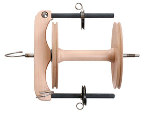 The Ashford Joy Sliding Hook Freedom Flyer Kit with Bobbin (Jumbo) by Ashford Handicrafts Limited is a light-colored, smoothly crafted wooden spinning wheel flyer assembly. It includes U-shaped arms holding metal rods equipped with hooks and springs, designed specifically for yarn spinning. The precise craftsmanship is evident in the detailed finish of the product.