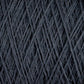 Close-up image of Jagger Brothers, Inc.'s JaggerSpun Maine Line 2/20 Yarn in dark gray, wound tightly around itself to form an intricate pattern of diagonal and crisscrossing lines. The texture appears soft yet dense, with the worsted spun strands showing slight variations in thickness.