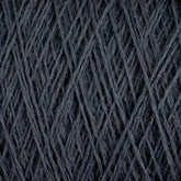 Close-up image of Jagger Brothers, Inc.'s JaggerSpun Maine Line 2/20 Yarn in dark gray, wound tightly around itself to form an intricate pattern of diagonal and crisscrossing lines. The texture appears soft yet dense, with the worsted spun strands showing slight variations in thickness.