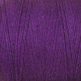 Close-up image of a spool of purple 8/2 Cottolin Organic Yarn | Mini-Cone from Maurice Brassard, showing its soft texture and intertwined strands. The yarn appears to be made of fine material, suitable for knitting or crocheting. The rich color suggests it could complement the cozy feel of crafting vibrant cotton linen blend tea towels.