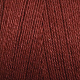 Close-up image of Maurice Brassard's 16/2 Bamboo Yarn in a rich burgundy color. The tightly wound strands showcase a deep red hue with a subtle sheen. The texture appears soft and smooth, making it an ideal choice for sustainable knitting or crocheting projects due to its antibacterial properties.
